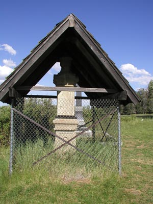 A monument with a fence around it